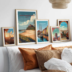 Northumberland Wall Art Print - Bamburgh Castle displayed among coastal and city skyline prints on a stylish wall.