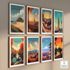Northumberland Wall Art Print - Bamburgh Castle and various city art prints arranged on a wall.