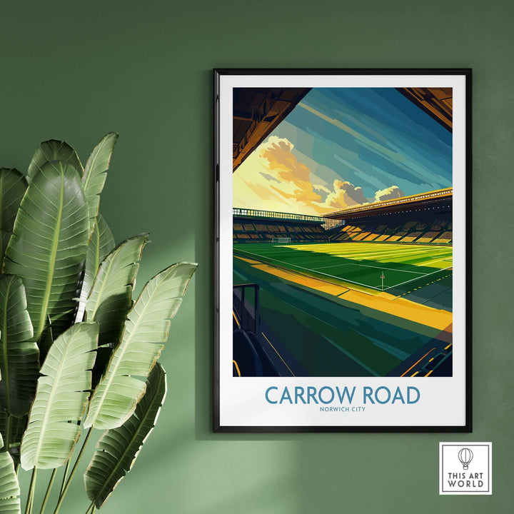 Norwich City Carrow Road inspired Football Stadium Wall Art Print framed on a green wall with a plant.