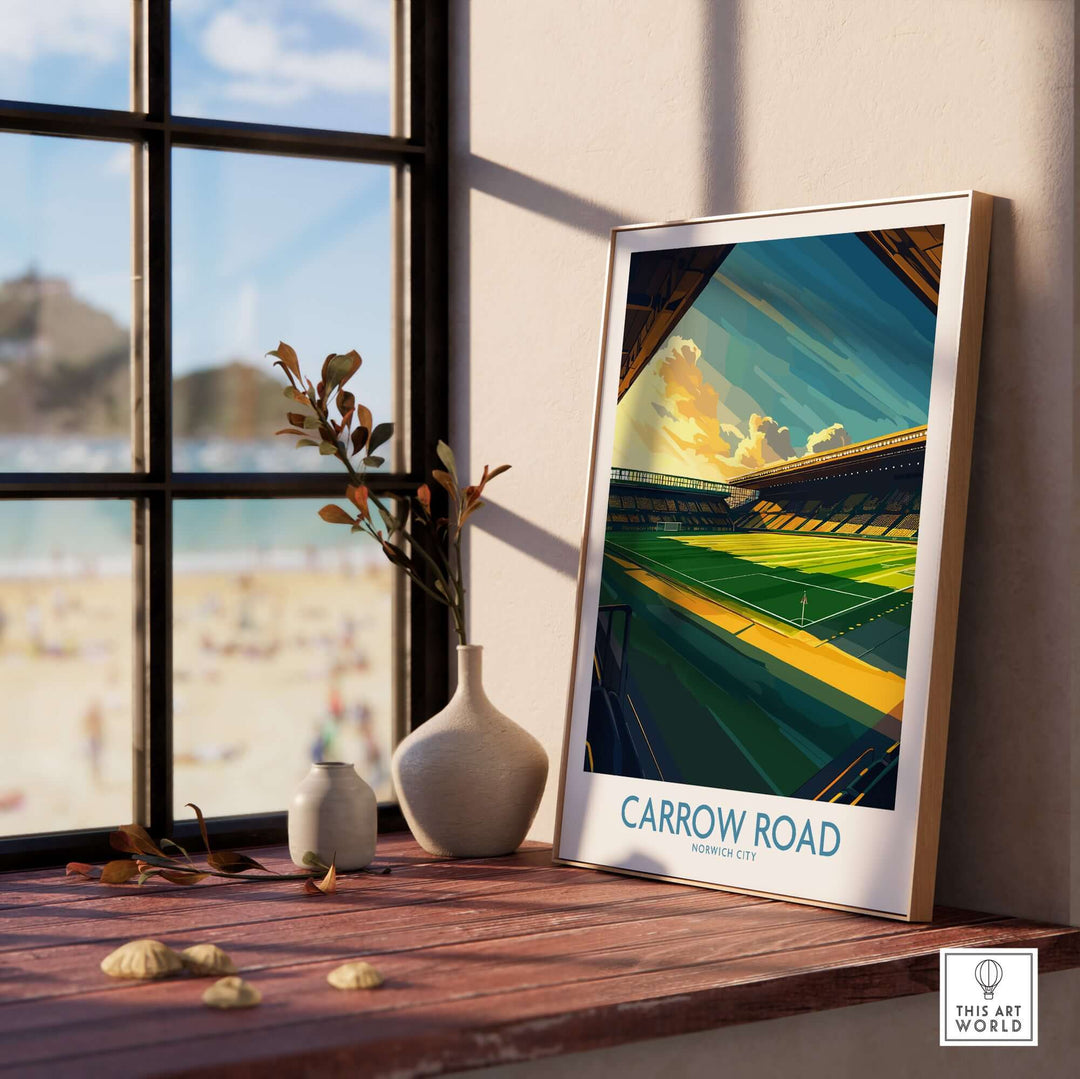 Stylish Norwich City Carrow Road Football Stadium Wall Art Print displayed on a wooden table by a sunny window.