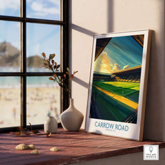 Norwich City - Carrow Road inspired Football Stadium Wall Art Print displayed in a cozy home setting with sunlight.