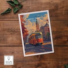 Novi Sad Travel Print - Serbia featuring a colorful tram and iconic architecture on a wooden background.