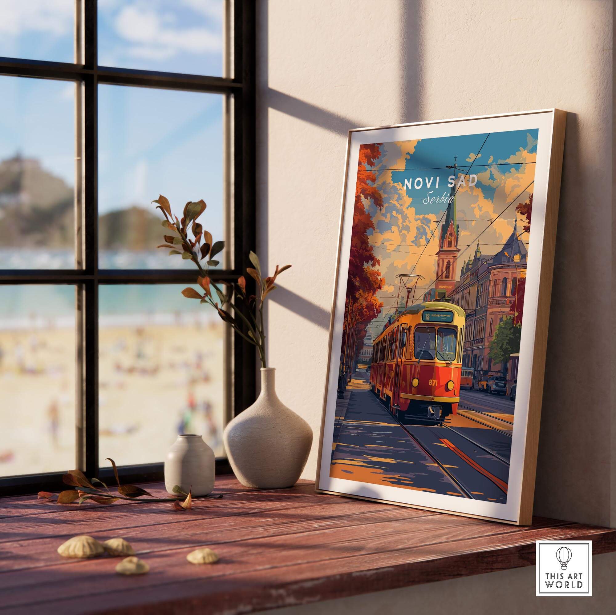 Novi Sad Travel Print - Serbia showcasing a colorful tram and beautiful architecture in a bright room setting.