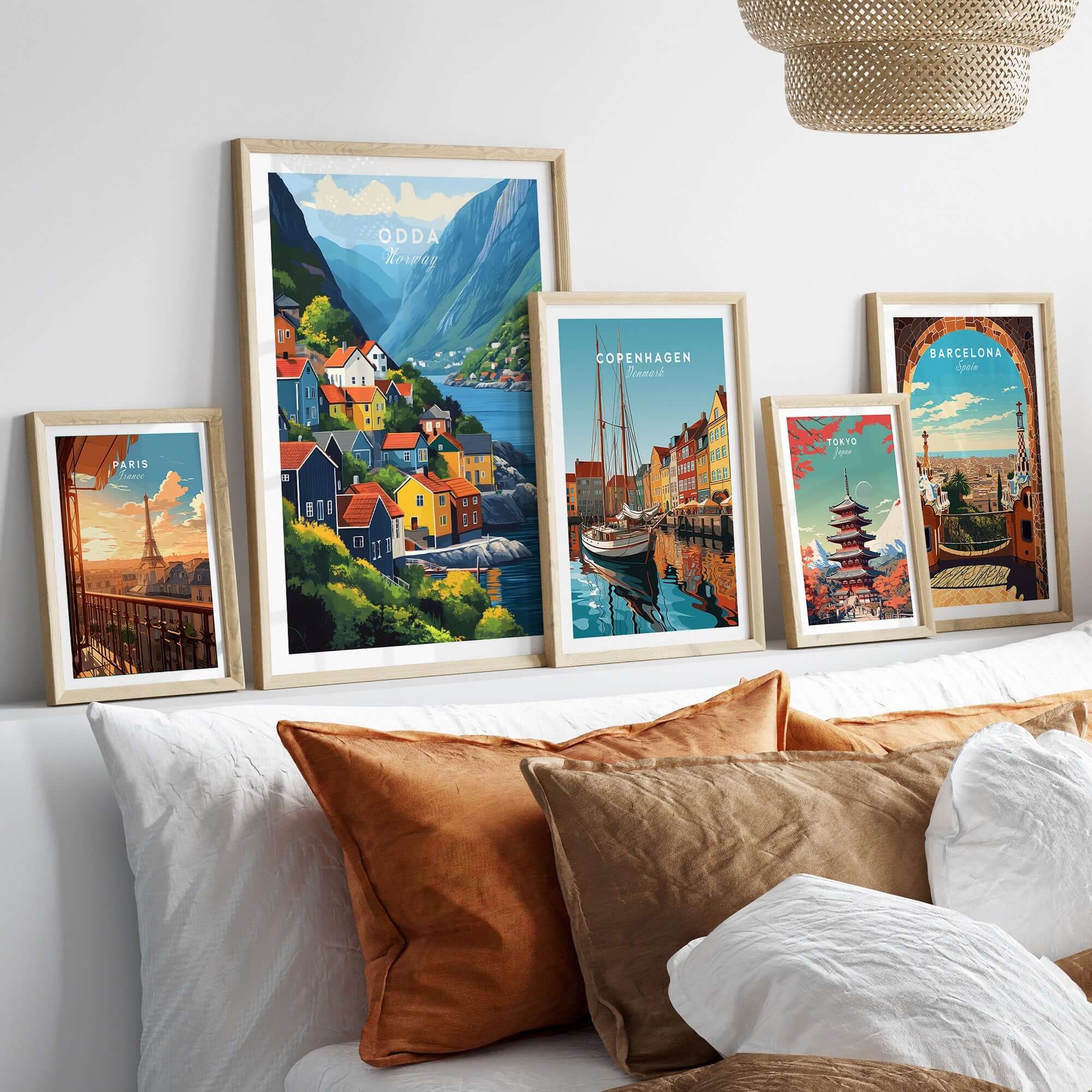 Odda Print Norway wall art displayed in stylish frames on a cozy sofa, showcasing Norway's beauty.