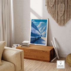 Orient Express Luxury Rail Mountain Scenery Print | Vintage Travel Wall Art displayed in a cozy living room setting.