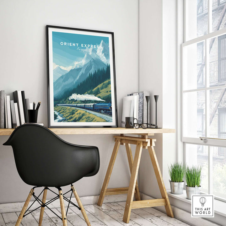 Orient Express Poster | Luxury Travel Wall Art displayed in a modern workspace featuring mountains and a train.
