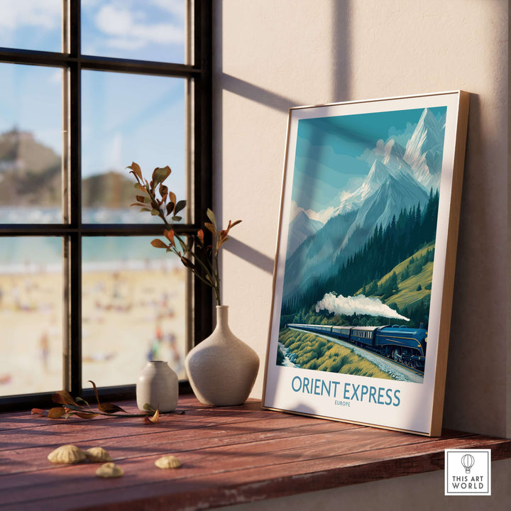 Orient Express Poster - Steam Train Art Print framed on a table with a scenic view outside a window.
