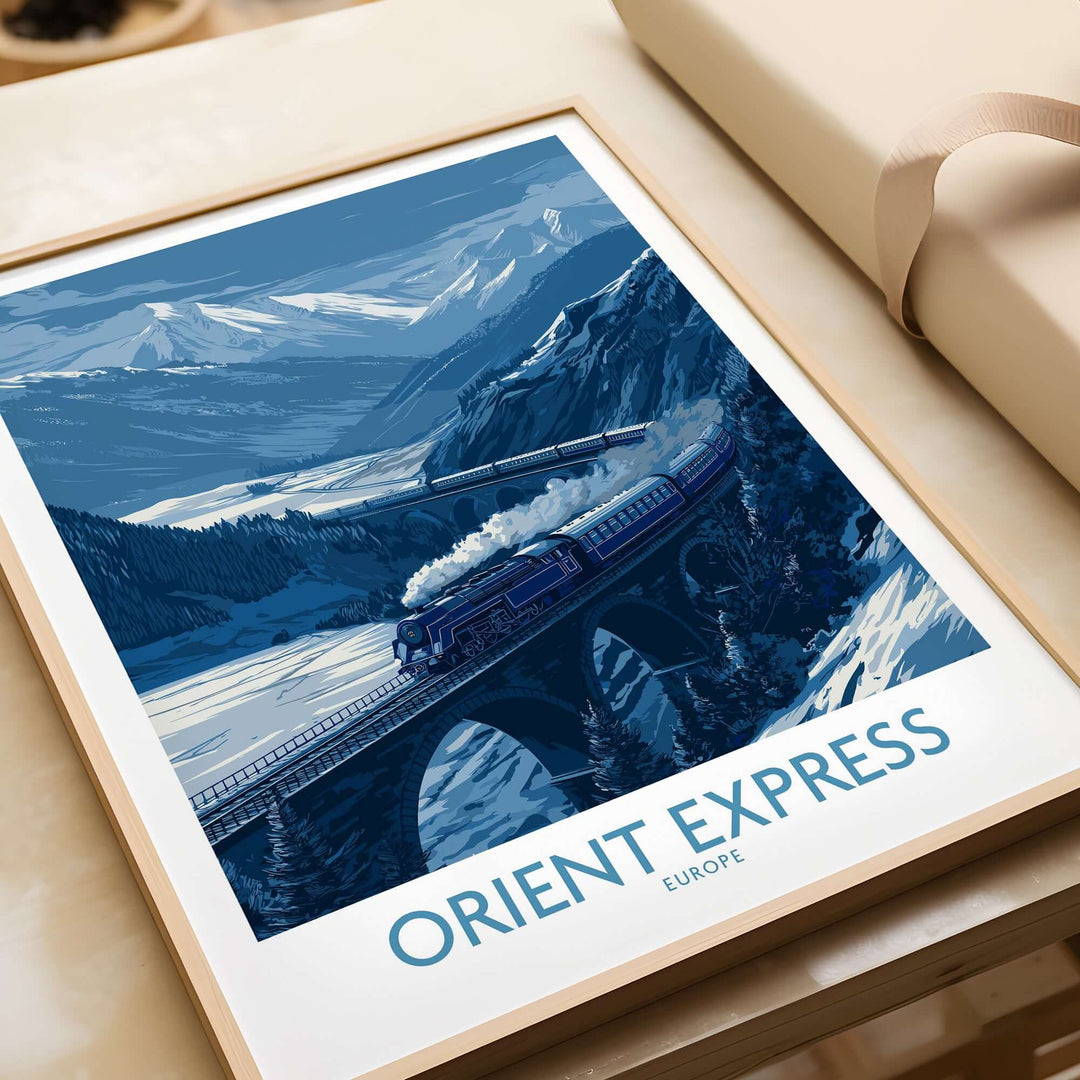 Orient Express Print | Snowy Mountain Poster featuring a blue-toned train crossing a snow-covered mountain landscape.