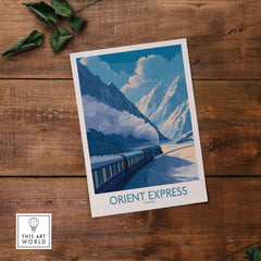 Orient Express Train Print | Snowy Alps Journey Poster featuring a train in a winter landscape with mountains.