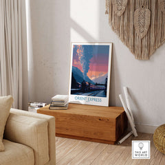 Orient Express Vintage Train Art Print displayed in a stylish living room setting on a wooden table.