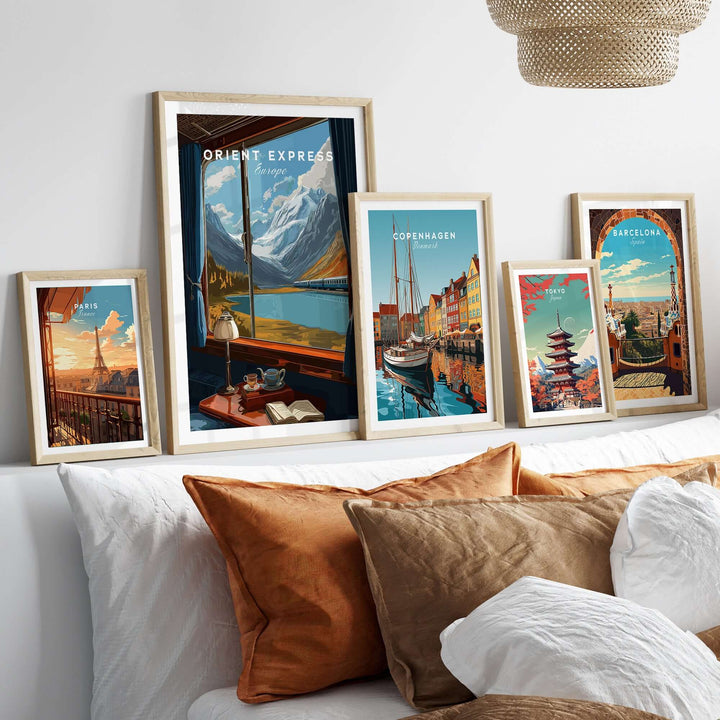Orient Express Wall Art Print | Alps Travel Home Decor displayed in stylish frames on a cozy bed with decorative pillows.
