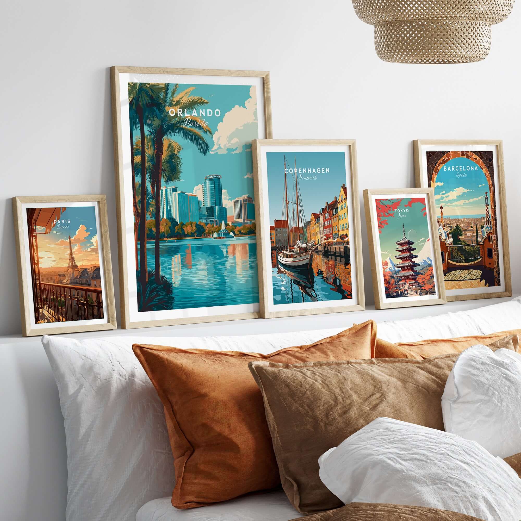 Orlando Print | Florida City Wall Art displayed in stylish frames above a cozy sofa, showcasing vibrant city scenes.