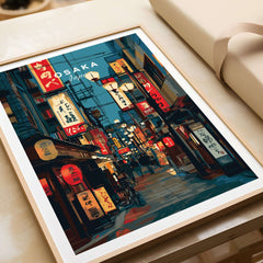 Osaka Travel Print Japan Lantern Street Poster - Vibrant Cityscape Wall Art framed on a table showcasing vibrant street scene.
