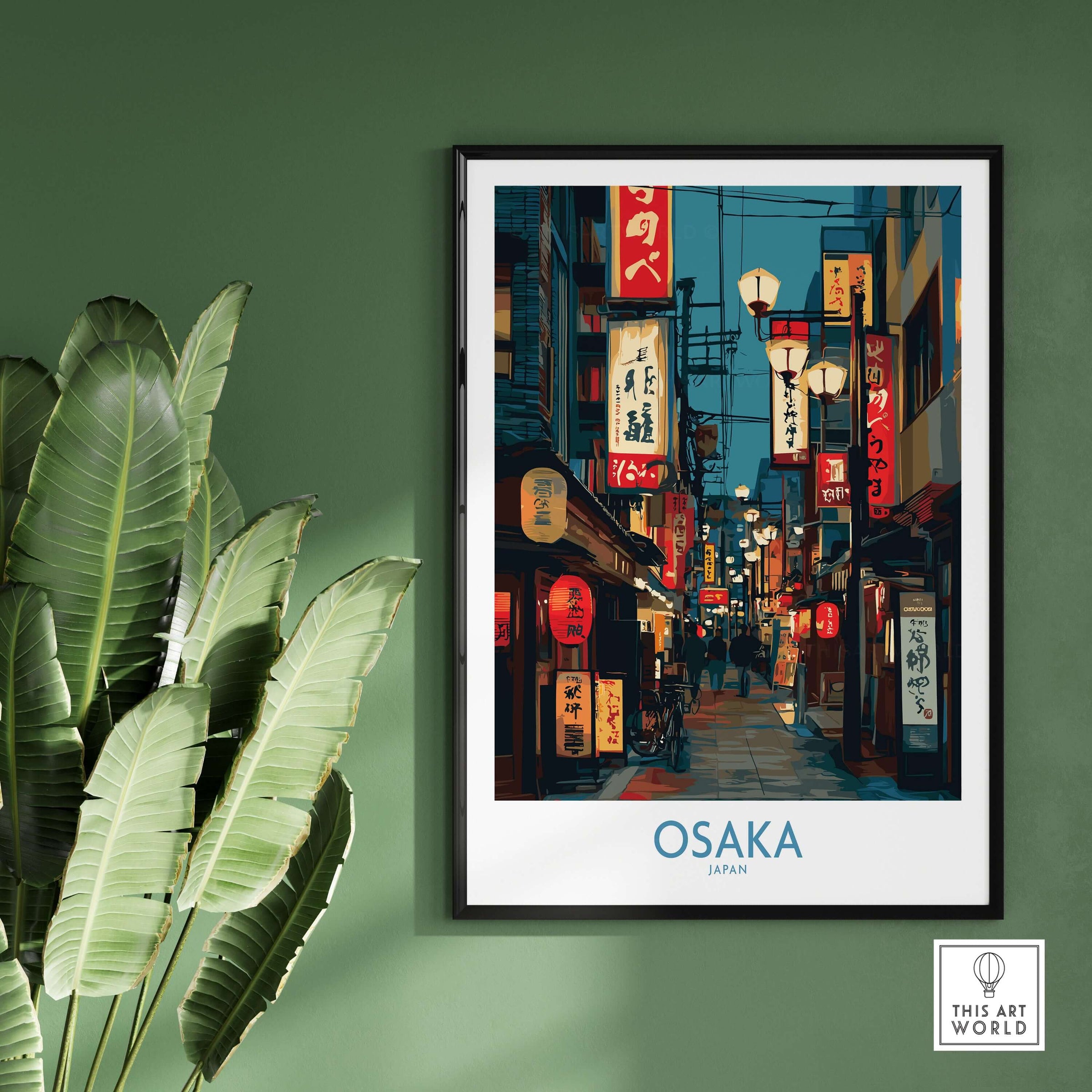 Osaka Japan Wall Art Print showcasing vibrant streets and culture in a stylish frame on a green wall.