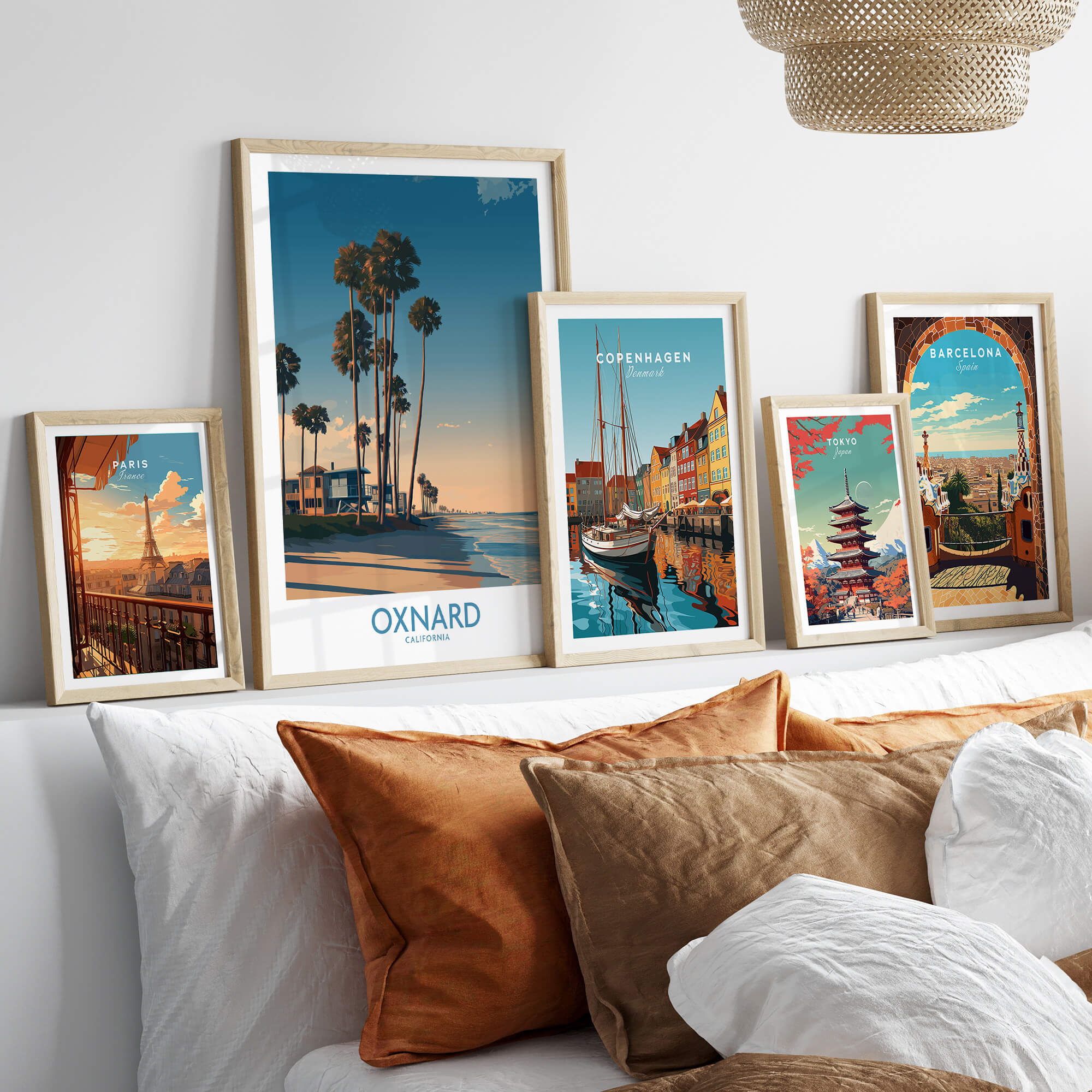 Oxnard Poster | California Beach House Sunset Canvas Print displayed on a cozy bed with decorative pillows.