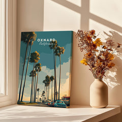 Oxnard California Wall Art Print | Palm Tree Lined Coastal Travel Poster displayed next to a vase with flowers.