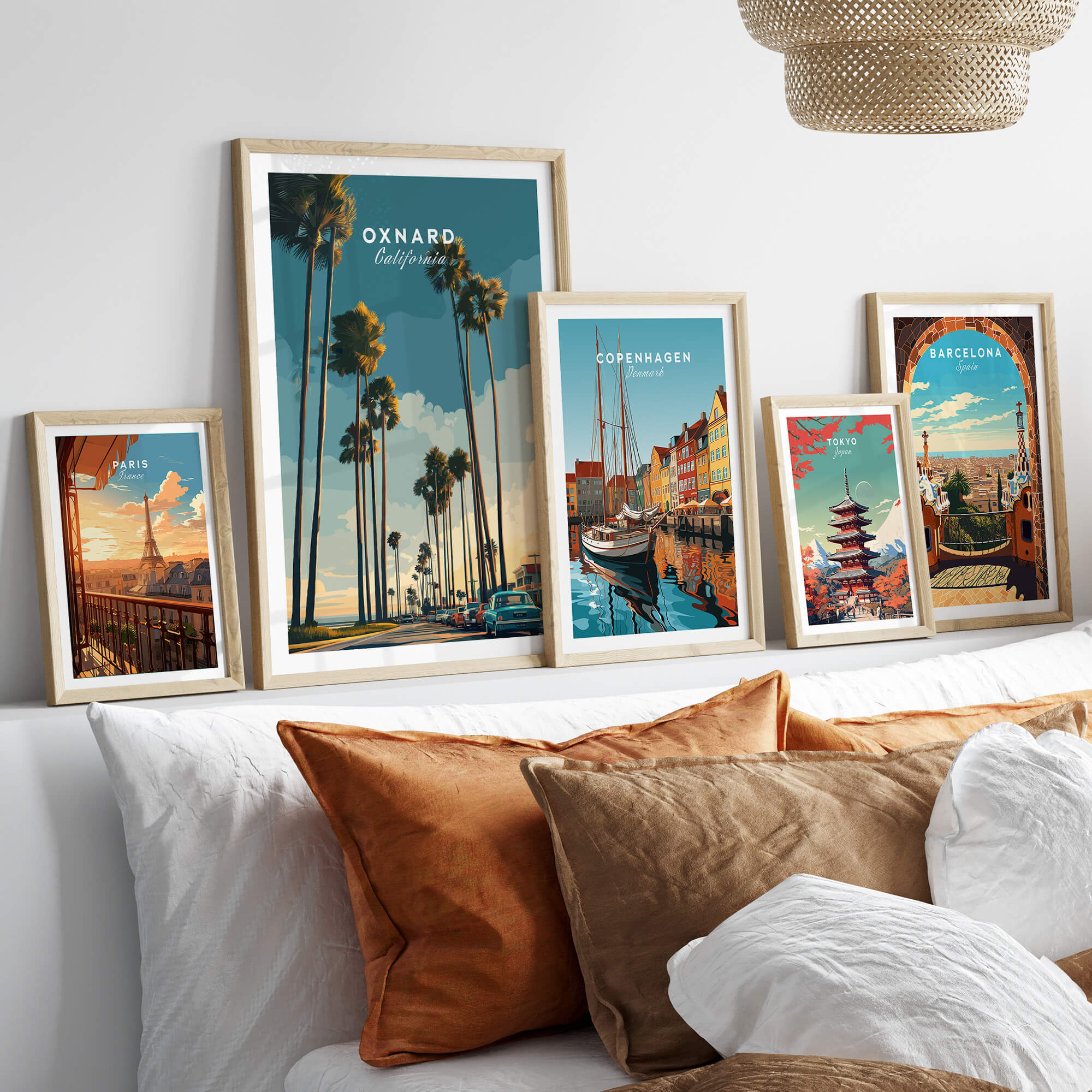 Oxnard California Wall Art Print | Palm Tree Lined Coastal Travel Poster styled on a sofa with other travel posters.