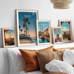 Oxnard California Wall Art Print | Pacific Coast Palms Travel Poster displayed in stylish frames on a bed.