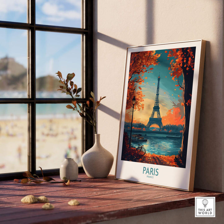 Paris poster featuring the Eiffel Tower, beautifully framed in a sunlit room with a view of the beach outside.