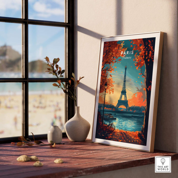 Paris Print featuring the Eiffel Tower, framed in a cozy room with scenic beach view and autumn foliage decor.