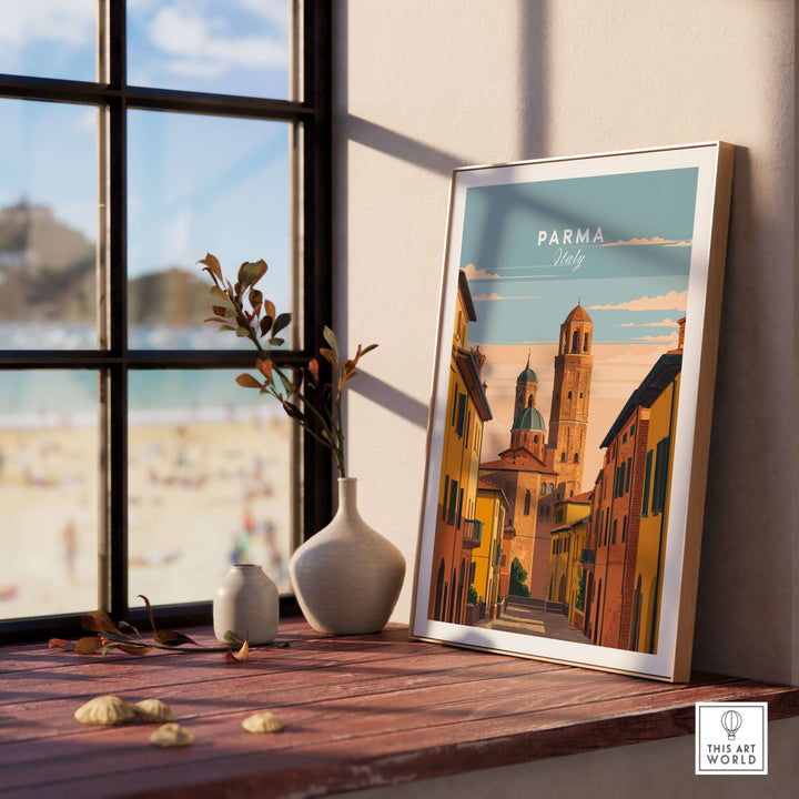 Parma art print displayed on a wooden table beside a window, featuring an Italian street scene in vibrant colors.