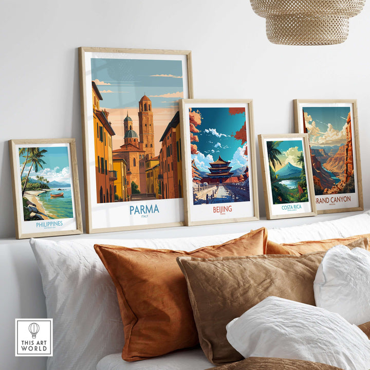 Framed art prints including Parma, Beijing, and Costa Rica cityscapes displayed on a wall above a cozy sofa.