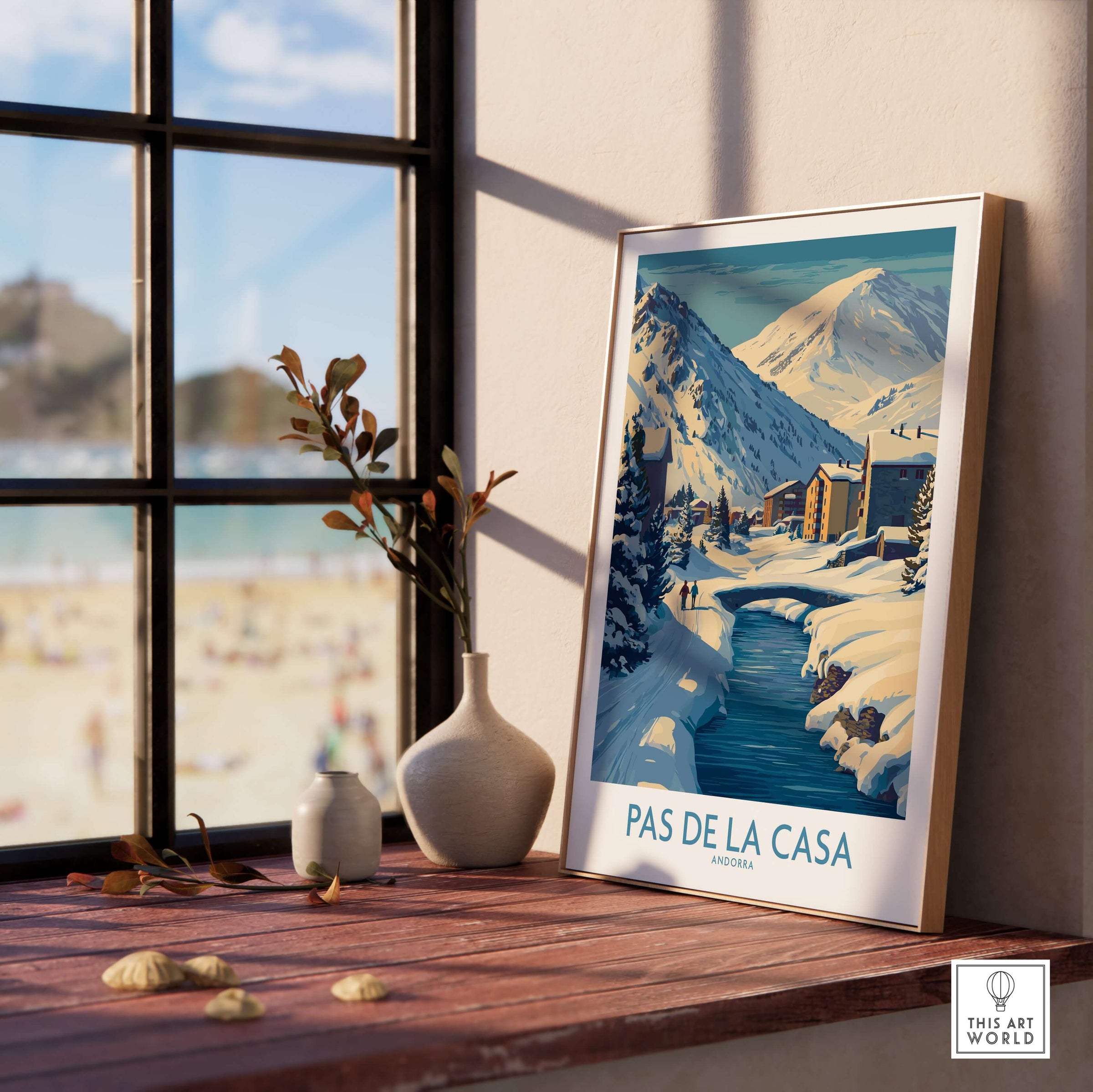 Pas de la Casa Andorra Art Print | Winter Village Bridge Poster displayed on a table near a window.