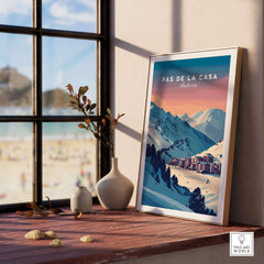 Pas de la Casa Wall Art | Andorra Travel Print displayed on a wooden table near a window with mountain view.