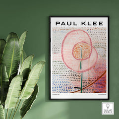 Paul Klee Blossoming Abstract Floral Modern Poster Art Print Decor displayed in a frame on a green wall with plants.