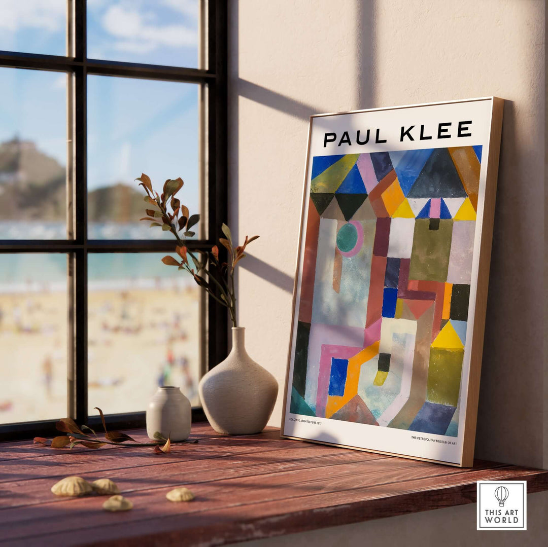 Paul Klee colorful geometric architecture art print displayed by a window with beach view.