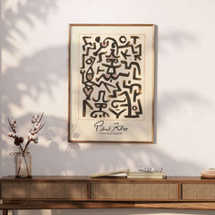 Paul Klee Comedians Handbill Abstract Figures Poster Modern Art Print showcasing whimsical symbols and shapes on a wall.