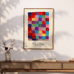 Paul Klee L univers De Klee Colorful Squares Abstract Grid Poster Art Print displayed on a wall, featuring vibrant geometric squares.