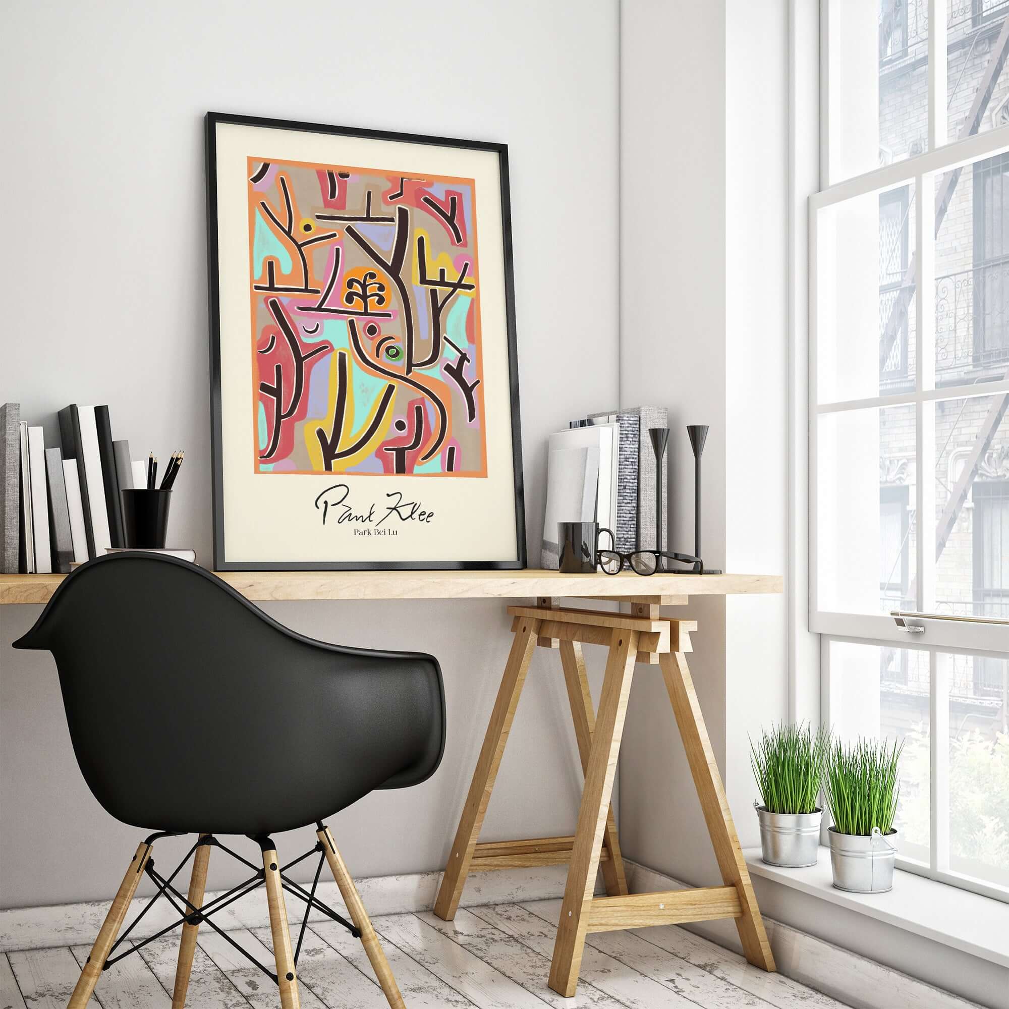 Paul Klee Park Bei Lu Colorful Abstract Landscape Poster Art Print displayed on a desk near a window in a modern room.