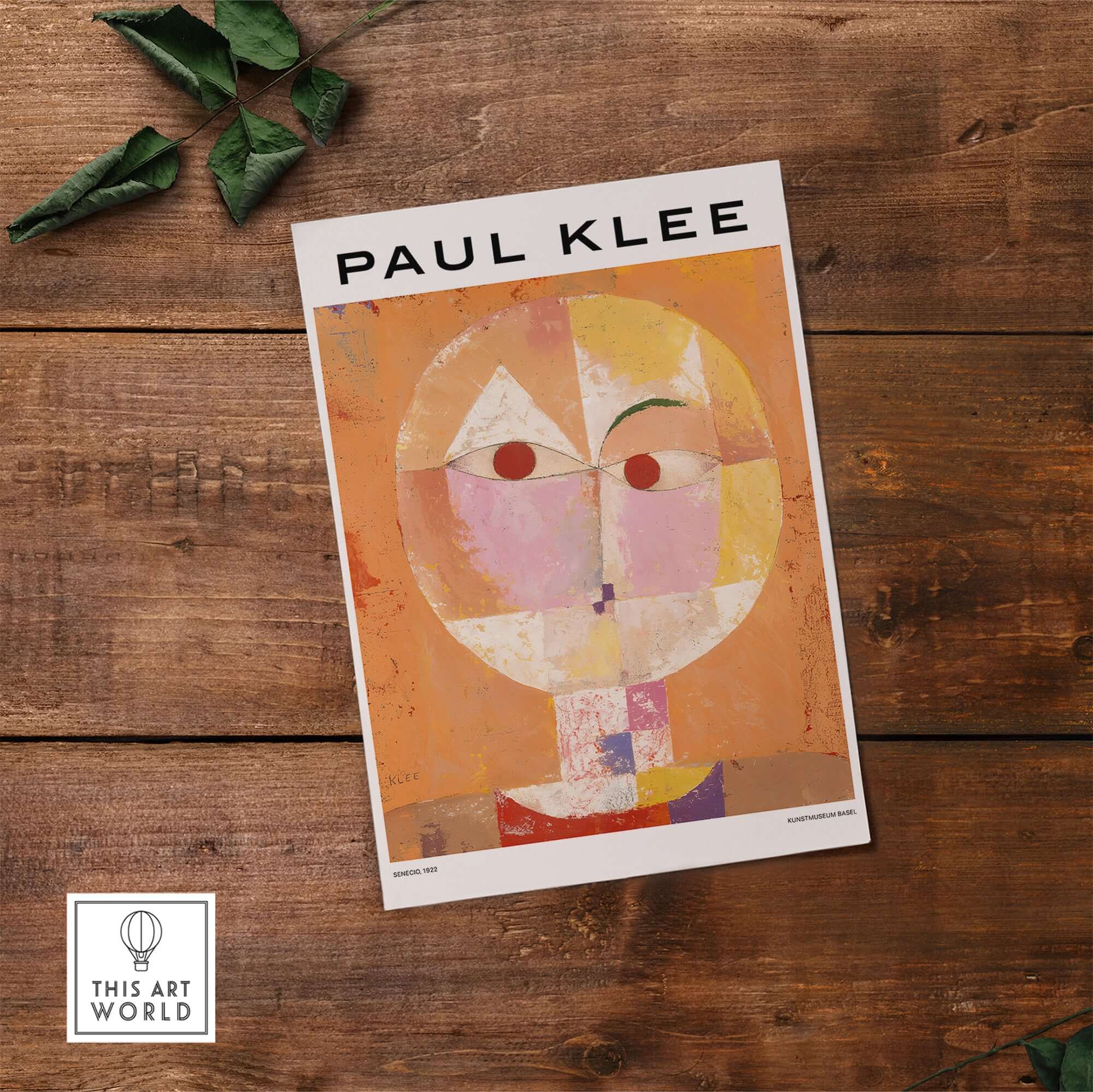 Paul Klee Senecio Head of Man Abstract Portrait Poster Art Print displayed on rustic wooden surface.
