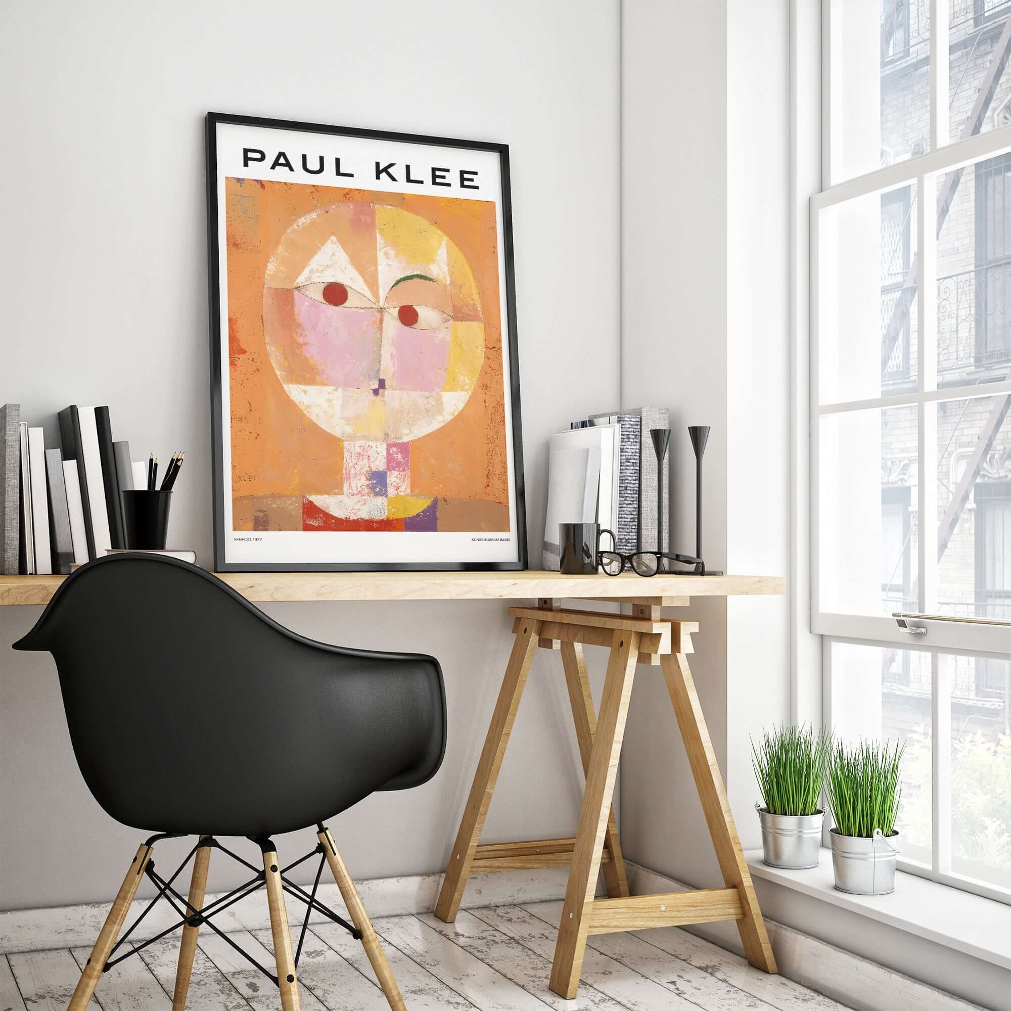 Paul Klee Senecio Head of Man Abstract Portrait Poster Art Print displayed in a stylish modern workspace.