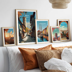 Peja Canvas Print | Balkan City Wall Art displayed among other city-themed artworks on a modern sofa.