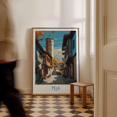 Peja Kosovo Old Town Street Art Print | Historic Tower View Poster displayed in a cozy interior setting.