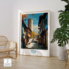 Peja Kosovo Old Town Street Art Print | Historic Tower View Poster displayed in a cozy interior setting.