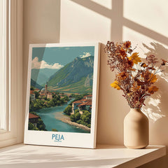 Peja Kosovo River Valley Art Print | Mountain Town Scenery Poster showcasing a serene landscape with mountains and a river.
