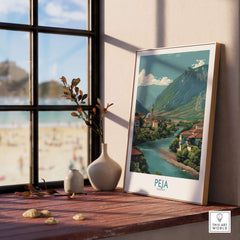Peja Kosovo River Valley Art Print | Mountain Town Scenery Poster displayed in a cozy room with a view.