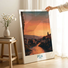 Peja Kosovo Sunset River Bridge Art Print | Mosque and Mountains Poster displayed in a home setting with warm sunset colors.
