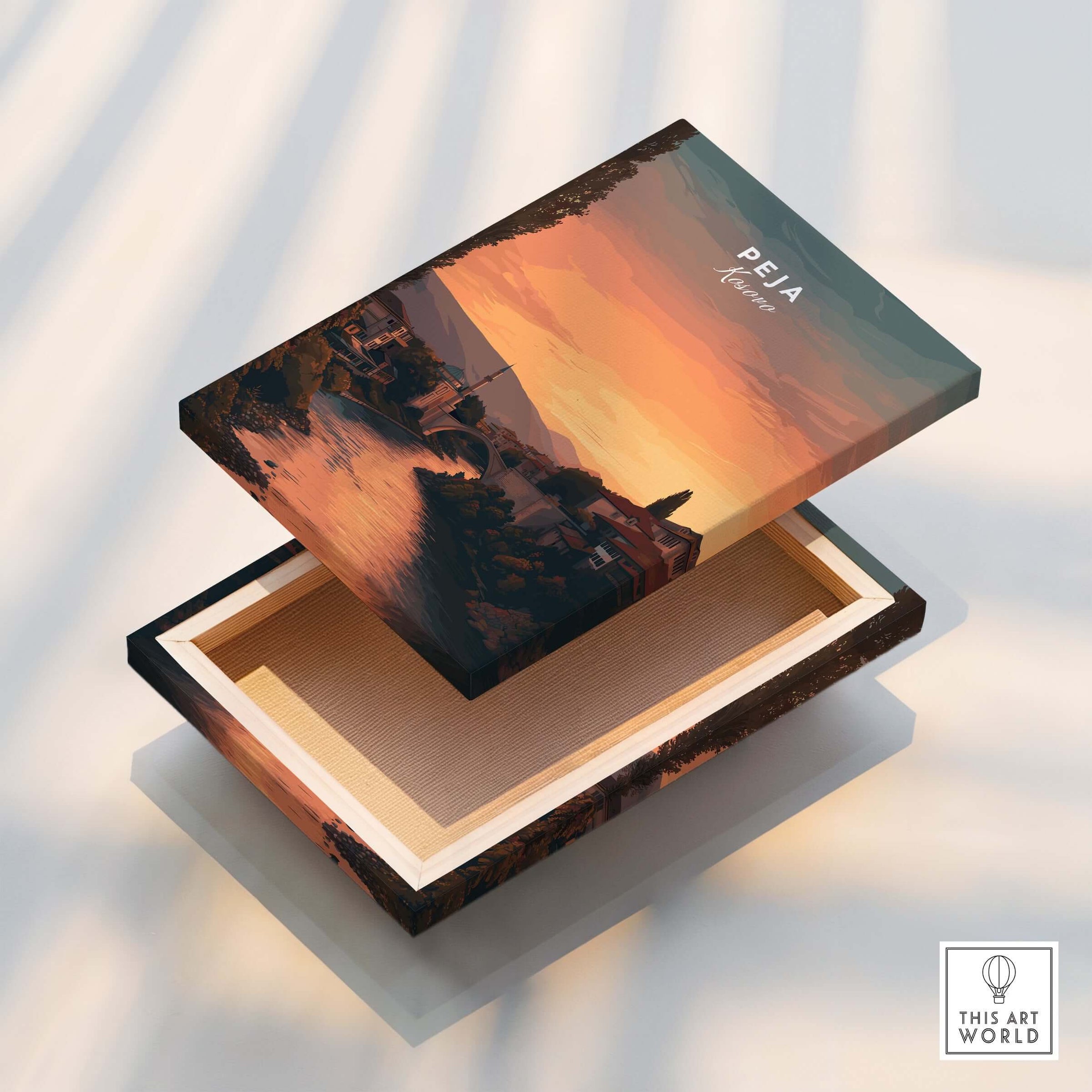 Peja Lumëbardhi River Twilight Canvas Print | Kosovo City Wall Decor shown on a decorative wooden box.