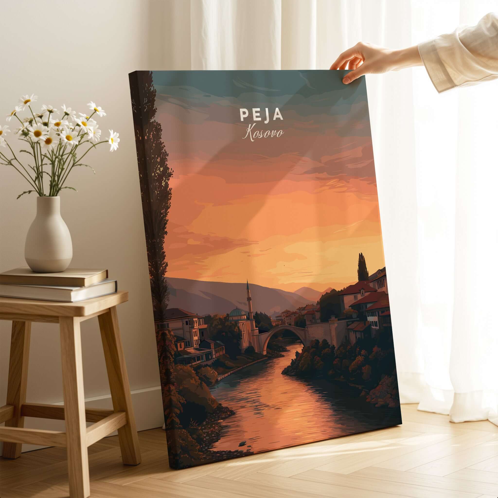 Peja Lumëbardhi River Twilight Canvas Print | Kosovo City Wall Decor displayed in a cozy setting with flowers.
