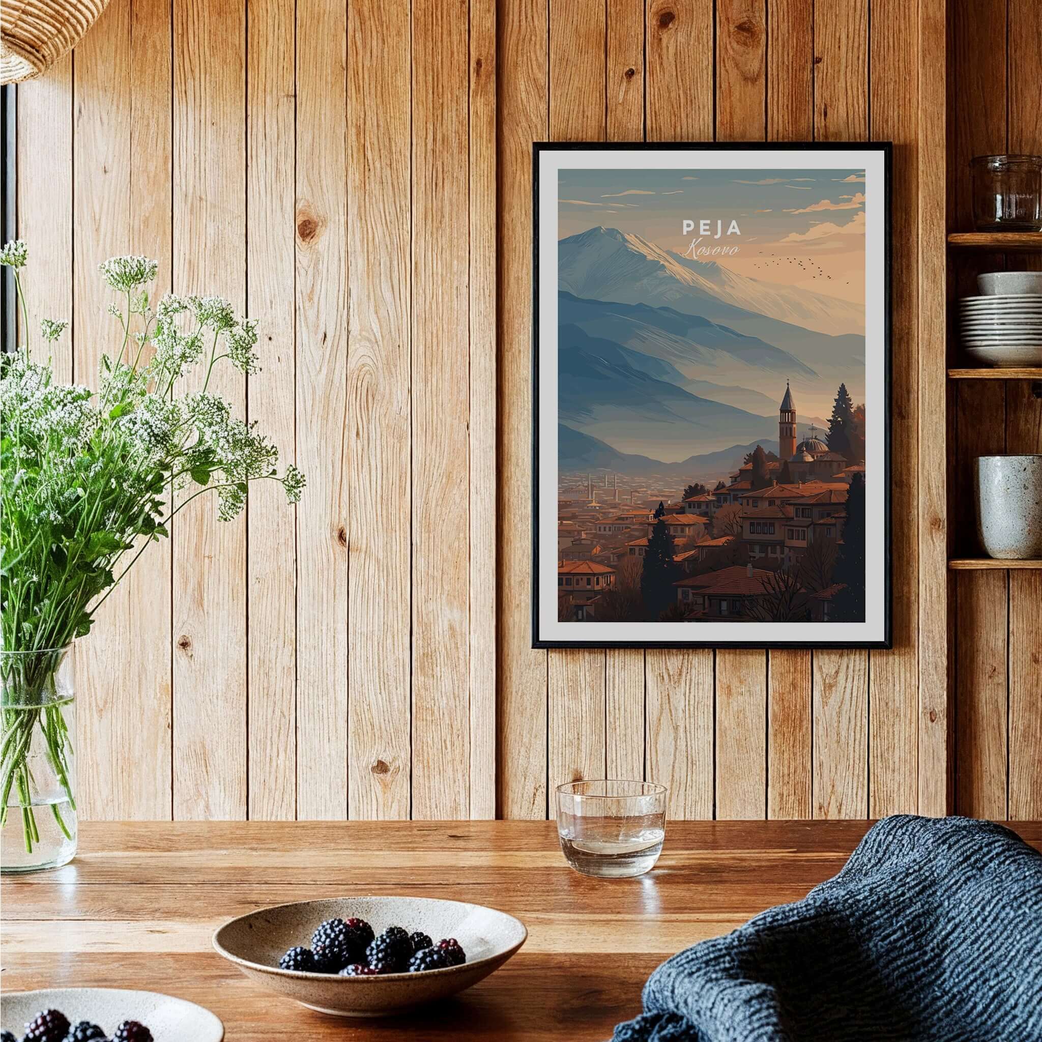 Peja Red Rooftops and Snow Mountain Canvas Print | Balkan Travel Decor displayed in a cozy wooden interior.