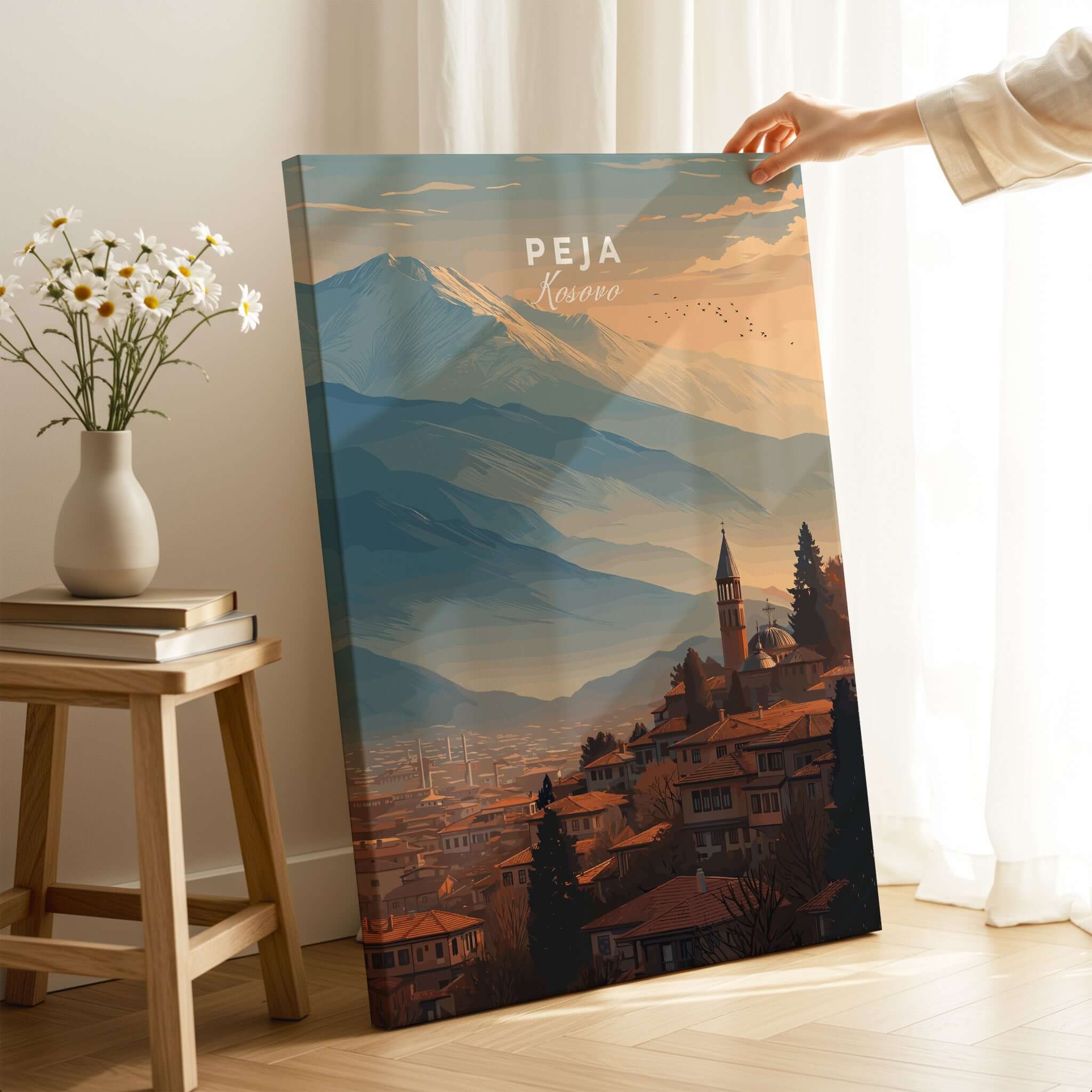 Peja Red Rooftops and Snow Mountain Canvas Print | Balkan Travel Decor displayed in a cozy setting.