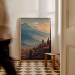 Peja Red Rooftops and Snow Mountain Canvas Print | Balkan Travel Decor displayed in a stylish room.