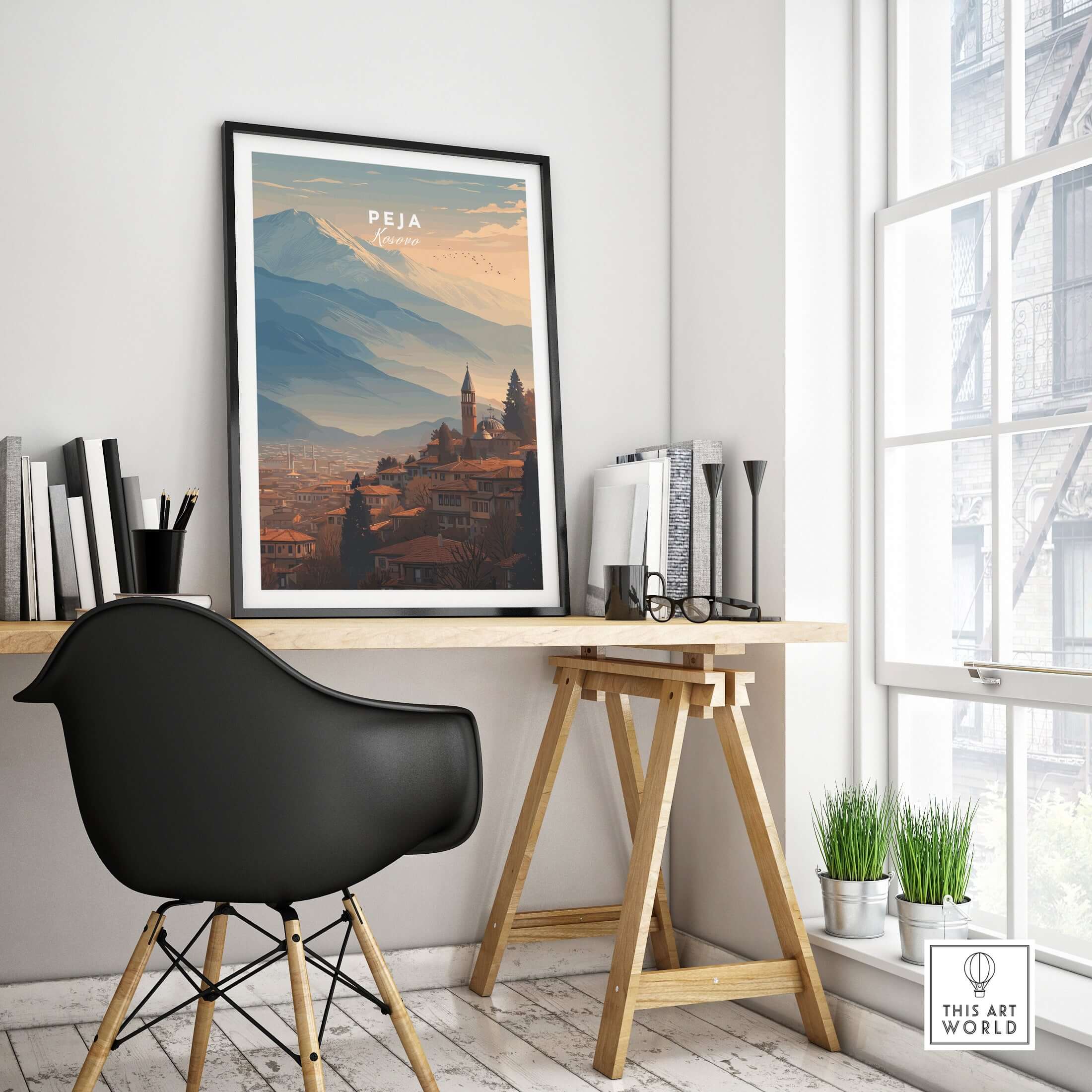 Peja Red Rooftops and Snow Mountain Canvas Print | Balkan Travel Decor displayed in a modern workspace.