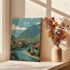 Peja Rugova Gorge Canvas Print | Balkan Landscape Decor displayed in a sunlit room next to a vase of dried flowers.