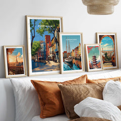 Perpignan Art Print - French Village Poster - Colorful Houses Wall Decor displayed with other art prints in a cozy living room.