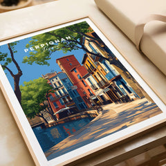 Perpignan Art Print - French Village Poster - Colorful Houses Wall Decor displayed in a stylish frame on a surface.